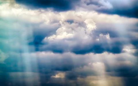 Rays of Sun through the clouds Stock Photos