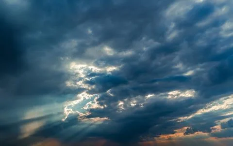 Rays of Sun through the clouds Stock Photos
