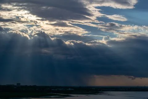 Rays of Sun through the clouds Stock Photos
