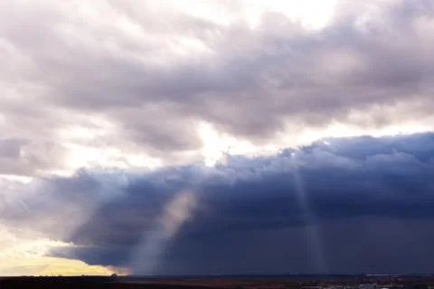 Rays of the sun through the clouds Stock Photos