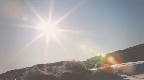 Rays of the sun twinkle in the snowy air Video stock 62860438