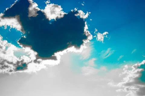 Rays of sunlight behind the clouds. High contrast. Stock Photos