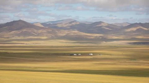 Rays of sunlight break through the clouds and cast sunspots in the idyllic la Foto stock