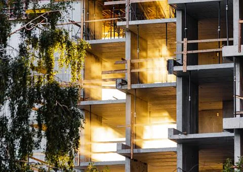 Rays of sunlight breaks through the glowing floors of a high-rise apartment Stock Photos