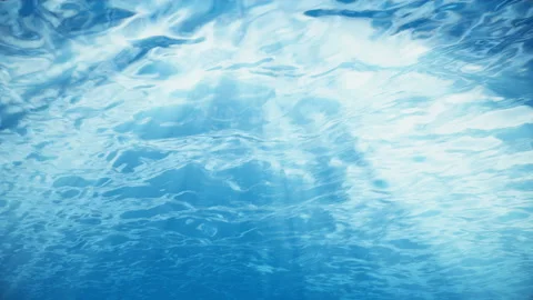 Rays of sunlight shining from above penetrate deep clear blue water. Sun light Stock Footage 113343600