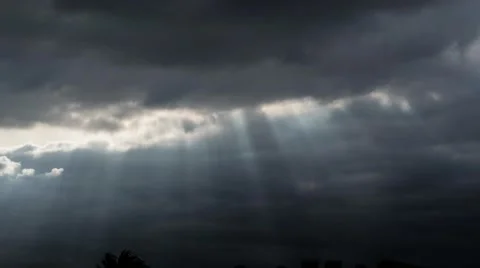 sun through rain clouds