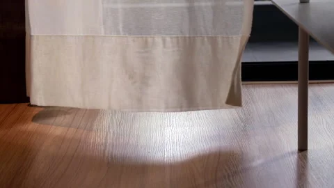 Rays of sunlight through curtain of open porch door of livingroom. Stock Footage 140713617