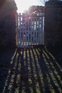 Rays of sunshine entering through a gate Foto stock