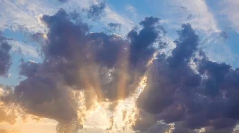 Rays of sunshine through the clouds Stock Photos