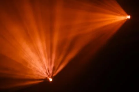 Rays theatrical spotlights on the stage during the performance Stock Photos