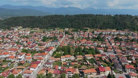 Razlog town and pine forest aerial Bulgaria Stock Footage 344057537