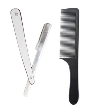 Razor and a comb on a white background Stock Photos