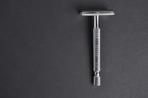 Razor on a black background. Close-up. Stock Photos