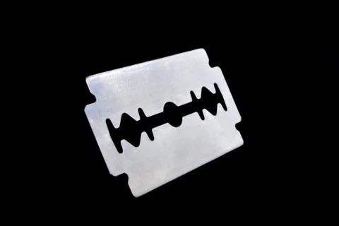 Razor blade on black background. The razor blade is a flat metal plate, Stock Photos