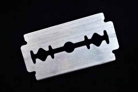 Razor blade on black background. The razor blade is a flat metal plate, Stock Photos
