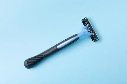 Razor blade on a blue background Stock Photos