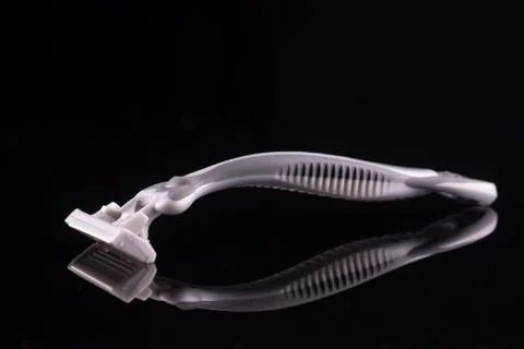 Razor with reflection isolated on a black background. Stock Photos