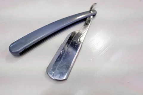 Razor sharp lying on a white table Stockfoto's