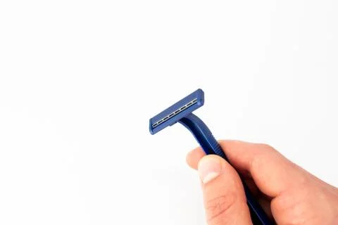 Razor on a white background in hand Stock Photos