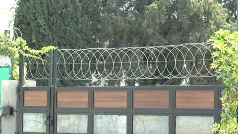 Razor Wire On An Electronic Security Gate Stock Footage 95021232