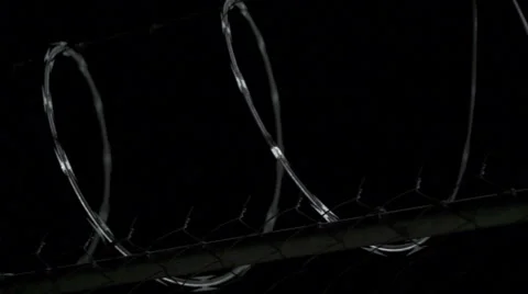 Razor Wire Night Dolly Stock Footage 43014624