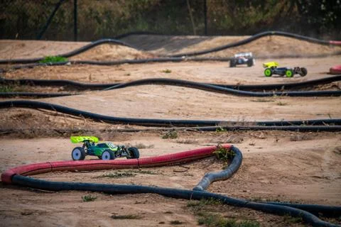 RC buggy going through a turn on an outdoor track during a race Stock Photos