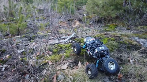 RC car crawler in the forest and mud path Stock Footage 122556277