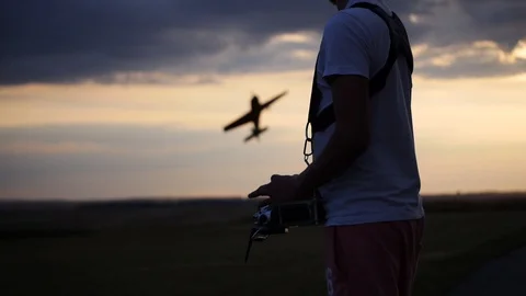 RC model aircraft at sunset Stock Footage 102021102