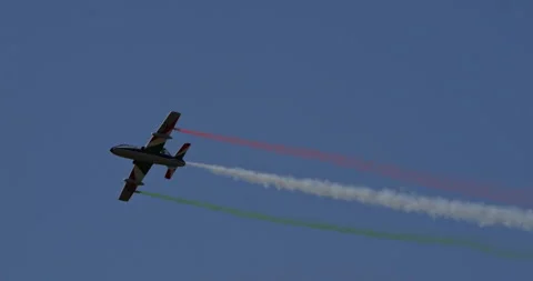 RC Model Flight Acrobatic Maneuvers Highlighted by Italian Flag Smoke Stock Footage 264111672