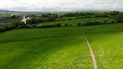 Rc plane flies over summer fields Stock Footage 108505151