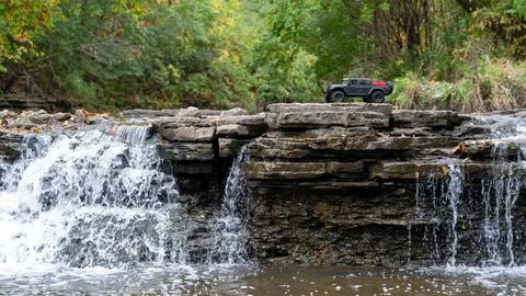 RC Truck on Right Third Composition  Rocky Waterfall Adventure Shot Stock Photos