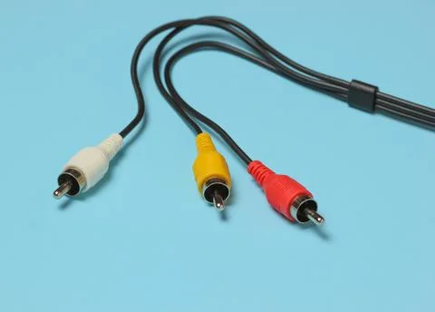 RCA cable on blue background. Stock Photos