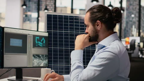 RD department researcher using machine learning tech to study solar green energy Stock Footage 316003747