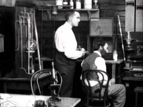 Re enactment of Thomas Edison inventing the light bulb. Stock Footage 75310091
