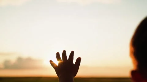 Reach out your hands to sky Little boy stretches his hand to sky, dreams in Stock Footage 252157230