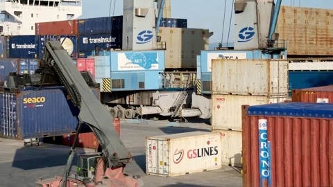 Reach stacker carry container in container area of port shipping yard Stock Footage 301307993