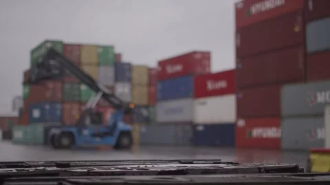 Reach Stacker Moving Cargo Boxes, Rainy Storage Yard, Shallow Depth of Field Stock Footage 341305065