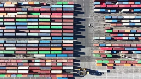 Reach stacker moving containers in a commercial port terminal Stock Footage 340512910