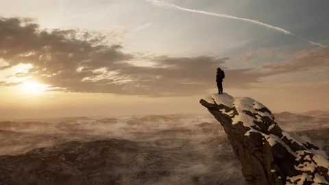 Reach the summit and conquer the snow-capped cliff at sunrise 库存影片 313816360