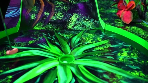 Reaching for and taking the golf ball at a jungle patterned pitch Stock Footage 220020094