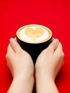 Reaching for coffee Foto stock