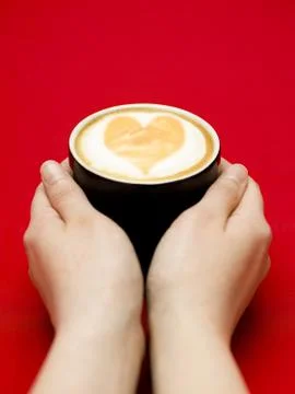 Reaching for coffee Stock Photos