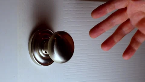 Reaching for doorknob - slow - horizontal Stock Footage 322720624