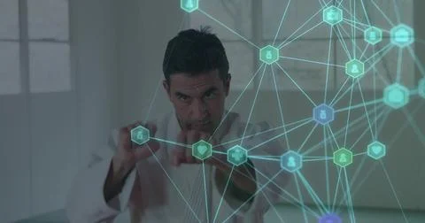 Reaching engineer in lab coat interacting with hologram in pale room, with heart Stock Photos