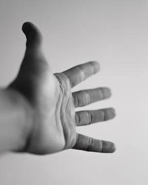 Reaching hand in a dynamic motion towards the viewer Fotos Stock