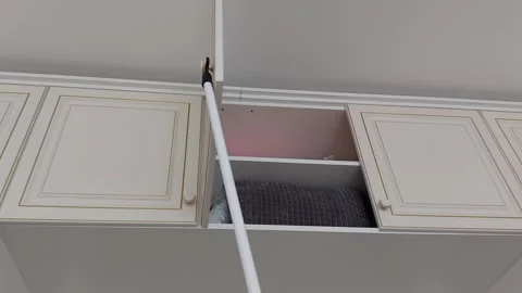 Reaching High: The Pillow Retrieval Trick 스톡 동영상 306062765