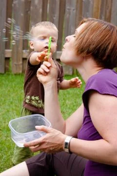 Reaching out for bubbles Stock Photos