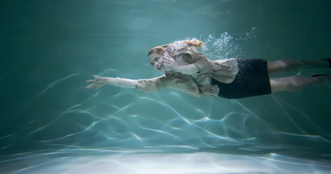 Reaching out to help customer. Young happy business woman in office suit swims Stock Footage 153884963