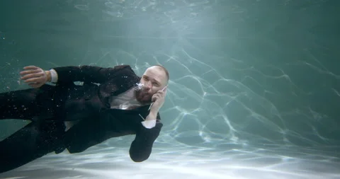 Reaching out to help customers. Young happy businessman in office suit swims 스톡 동영상 153780772