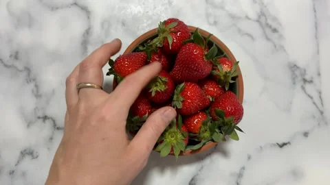 Reaching for Strawberries Stock Footage 310494037
